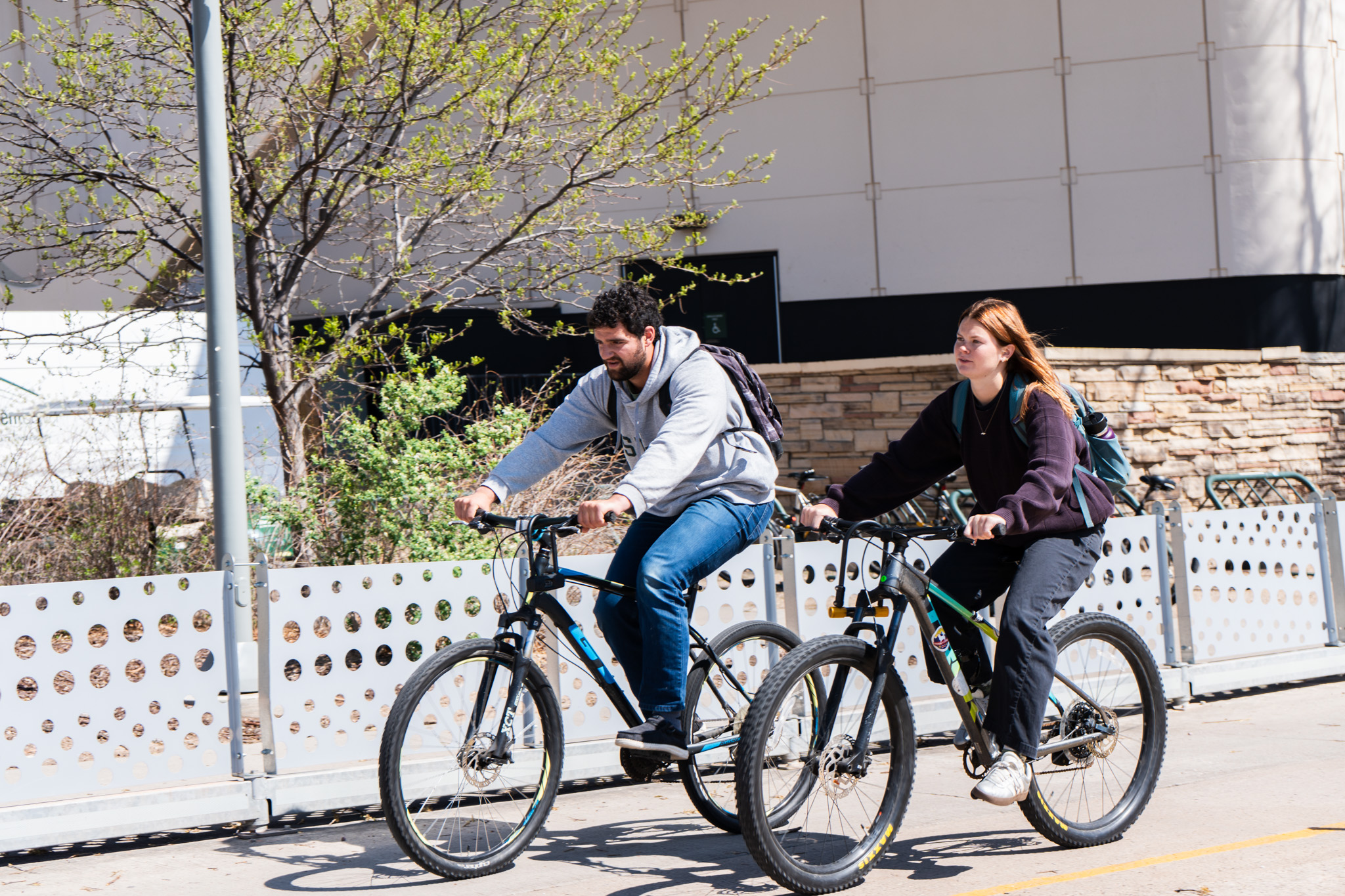 Students biking on bike lane.